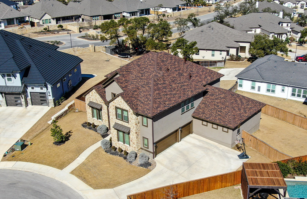 a brown and tan roof with shingles in san antonio residential areas
